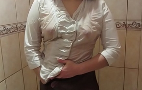 Girl in a uninspiring blouse, in black pantyhose masturbates in someone's skin shower to orgasm.